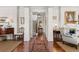 Elegant hallway with hardwood floors, decorative rugs, and classic architectural details at 1518 Cambridge Ave, Atlanta, GA 30337