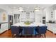 Large kitchen with central island, marble countertop, stainless steel appliances, and ample storage at 1518 Cambridge Ave, Atlanta, GA 30337