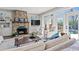 Inviting living room features a stone fireplace, French doors to the pool, and comfortable seating at 1518 Cambridge Ave, Atlanta, GA 30337