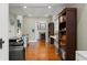 Spacious office with hardwood floors, built-in shelving, desk space, and fireplace at 1518 Cambridge Ave, Atlanta, GA 30337