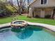Inviting pool and spa, set amidst a beautifully landscaped backyard with a fire pit at 1518 Cambridge Ave, Atlanta, GA 30337