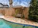 Charming backyard features a serene pool, swing bench, and peaceful outdoor space at 1518 Cambridge Ave, Atlanta, GA 30337