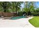 Private backyard featuring a beautiful pool with a slide, hot tub and lounge area, perfect for outdoor entertainment at 1518 Cambridge Ave, Atlanta, GA 30337
