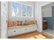 Cozy reading nook with built-in bench seating, storage drawers, and decorative pillows at 1518 Cambridge Ave, Atlanta, GA 30337
