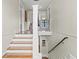 Bright staircase features a decorative railing and natural light at 1518 Cambridge Ave, Atlanta, GA 30337