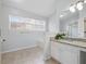 Bright bathroom with granite countertops, a garden tub, and large window with natural light at 2304 Stancrest Ln, Lawrenceville, GA 30044