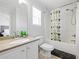 Bathroom featuring an extended vanity, a toilet, and a shower-tub combination at 2304 Stancrest Ln, Lawrenceville, GA 30044