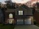 Charming two-story home featuring a well-manicured lawn and a two-car garage at 2304 Stancrest Ln, Lawrenceville, GA 30044