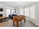 A Gathering and game room featuring a foosball table and a connecting living room space at 2304 Stancrest Ln, Lawrenceville, GA 30044
