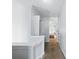 Hallway leading to a bedroom, highlighting natural light and a neutral color palette at 2304 Stancrest Ln, Lawrenceville, GA 30044
