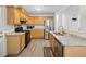 Updated kitchen features stainless steel appliances, granite counters and wood cabinetry at 2304 Stancrest Ln, Lawrenceville, GA 30044