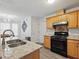 An open kitchen features granite counters, neutral cabinets, and sightlines to the game room at 2304 Stancrest Ln, Lawrenceville, GA 30044