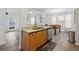 Open kitchen concept with granite countertops, hardwood floors, and a view into the living area at 2304 Stancrest Ln, Lawrenceville, GA 30044