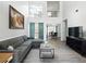 Bright living room boasts soaring ceilings, large windows, and modern furnishings at 2304 Stancrest Ln, Lawrenceville, GA 30044