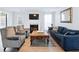 An open living room offers a fireplace, TV, sofa, chairs and hardwood floors at 2304 Stancrest Ln, Lawrenceville, GA 30044