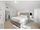 The main bedroom features neutral tones, with a large bed and a walk-in closet at 2304 Stancrest Ln, Lawrenceville, GA 30044