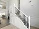 Bright, two-story foyer with a staircase featuring black metal balusters and access to a dining area at 2304 Stancrest Ln, Lawrenceville, GA 30044