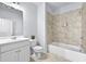 Bathroom featuring vanity sink, toilet and tiled tub-shower combination at 4362 White Spruce Aly, Doraville, GA 30360