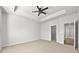 Spacious bedroom with neutral carpet and ceiling fan and access to ensuite bath at 4362 White Spruce Aly, Doraville, GA 30360
