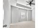 Bright bedroom with carpet, ceiling fan, and tray ceiling, offering a cozy retreat at 4362 White Spruce Aly, Doraville, GA 30360