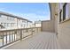 Large deck features a white railing with neighborhood views in this lovely home at 4362 White Spruce Aly, Doraville, GA 30360