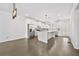 Bright kitchen with stainless steel appliances, white cabinets, a spacious island, and modern pendant lighting at 4362 White Spruce Aly, Doraville, GA 30360