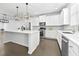 Modern kitchen featuring stainless steel appliances, white cabinetry, quartz countertops, and a large center island at 4362 White Spruce Aly, Doraville, GA 30360