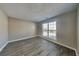 Bedroom with neutral walls and ample natural light from a large window at 930 Rafington Dr, Lawrenceville, GA 30046