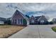 Charming brick home with a well-manicured lawn and a long driveway at 930 Rafington Dr, Lawrenceville, GA 30046