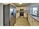Modern kitchen with stainless steel appliances and granite countertops at 930 Rafington Dr, Lawrenceville, GA 30046