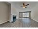 Bright living room features a fireplace and hardwood floors at 930 Rafington Dr, Lawrenceville, GA 30046