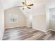 Spacious bedroom featuring wood flooring, high ceilings, and natural light at 100 Nottingham Dr, Douglasville, GA 30134