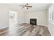 Inviting living room with fireplace and wood-look floors at 100 Nottingham Dr, Douglasville, GA 30134