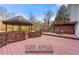 Expansive backyard deck offering plenty of space for outdoor entertaining and relaxation with a gazebo at 1710 Meadowchase Ct, Snellville, GA 30078