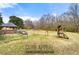 Expansive backyard featuring a gazebo, playset, and ample space for outdoor activities at 1710 Meadowchase Ct, Snellville, GA 30078