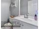 Cozy half-bathroom with a white vanity, silver faucet, and light gray walls at 1710 Meadowchase Ct, Snellville, GA 30078