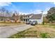 Wide exterior shot of a two-story home, showcasing its spacious driveway and well-maintained lawn at 1710 Meadowchase Ct, Snellville, GA 30078