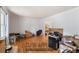 Spacious living room featuring hardwood floors and lots of natural light, ready for your personal touch at 1710 Meadowchase Ct, Snellville, GA 30078