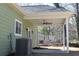 Covered back porch offers a relaxing space with ceiling fan and seamless access to the home at 6022 Fieldcrest Dr, Morrow, GA 30260