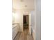 Bathroom featuring a granite countertop, double sinks and wood-look floors at 92 Fairview Oak Trce, Dallas, GA 30157