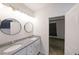 Bathroom features double vanity sinks with granite countertop and modern lighting at 92 Fairview Oak Trce, Dallas, GA 30157