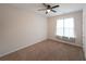 This bedroom has a ceiling fan, soft carpet, and natural light at 92 Fairview Oak Trce, Dallas, GA 30157