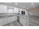 Well-lit kitchen featuring granite countertops, stainless steel appliances, and easy access to the living room at 92 Fairview Oak Trce, Dallas, GA 30157