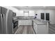 Well-lit kitchen featuring stainless steel appliances, granite countertops, and modern white cabinetry at 92 Fairview Oak Trce, Dallas, GA 30157