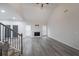 Bright living room with vaulted ceilings, wood floors, a fireplace, and a staircase to the second level at 92 Fairview Oak Trce, Dallas, GA 30157