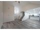 Spacious living room flowing into the kitchen area, featuring sleek floors and a vaulted ceiling at 92 Fairview Oak Trce, Dallas, GA 30157