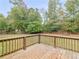 Backyard wooden deck with a wood fence at 1605 Mcgarity Rd, Mcdonough, GA 30252