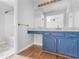 Bathroom vanity with blue cabinets and granite countertop at 1605 Mcgarity Rd, Mcdonough, GA 30252