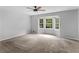 A spacious carpeted bedroom with bay window at 1605 Mcgarity Rd, Mcdonough, GA 30252