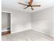 Carpeted bedroom with a ceiling fan and neutral walls at 1605 Mcgarity Rd, Mcdonough, GA 30252